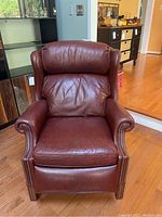 Front view of recliner showing seat, arms, and back