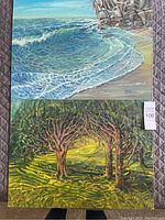 Photo showing both paintings laid out: ocean wave scene and forest path scene, both signed by Kamden