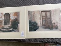 Two signed photographs by Rebecca Denison showing doors, mounted on cream backing and covered in plastic.