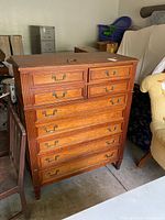 Front view of the vintage Rway dresser showing 9 drawers with metal handles, wood finish, and vertical fluted trim on corners.