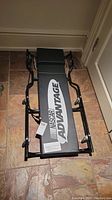 Full view of the NASCAR Advantage branded automotive creeper with padded surface and metal frame.