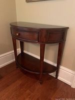 Overall front view of half-round console table
