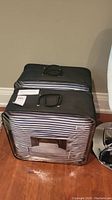 Packaged set of European pillows and shams with visible striped pattern through clear carrying bag.