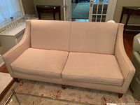 Front angle view of the sofa showing overall shape and upholstery
