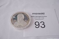 Front side of the silver coin showing President Gerald Ford's portrait with inscriptions.