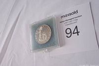 Front side of the silver coin showing the Statue of Liberty design and '$5 DOLLARS' text.