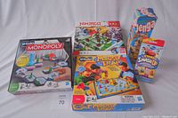 Lot of five children's boxed games including Monopoly u-build, Lego Ninjago, Mouse Trap, Jenga, and Disney Story Smash Up.