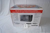 Box of Gourmia air fryer toaster oven showing product features and French doors design.