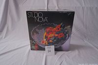 Photo of the Studio Nova salad bowl box showing the product image with fruits inside and the Studio Nova brand name on the front.