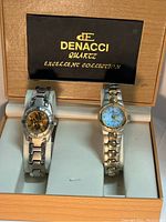 Photo showing two Denacci watches in original box with brand label visible inside lid