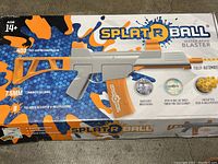 Box front showing product name, 7.5mm water bead ammo capacity of 400 rounds, 8 rounds per second fire rate, fully automatic function, and target included.