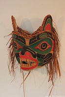 Mask front-right view showing carved formline details and paint palette