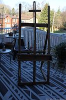 Front view of wooden adjustable easel standing on deck