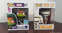 Front view of boxed Gamora and L3-37 Funko Pop figures side by side