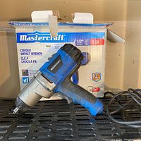 Photo of the Mastercraft impact wrench front side and partial box with branding and specs visible.