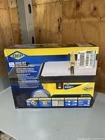 Front view of the boxed QEP 650 XT tile wet saw table showing brand, model, and key features.