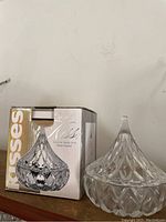 Photo of the covered candy dish made to look like a Hershey's Kiss with its original box labeled 'Shannon Crystal Kisses Covered Candy Dish'