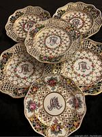 All six plates arranged together showing lot composition