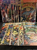 Front view of collection showing comics bagged with boards, colorful sci-fi themed covers visible.