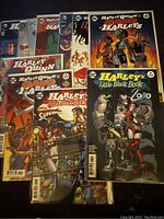 Collection of Harley Quinn comics with visible covers for multiple series and issues showing artwork of characters and titles.