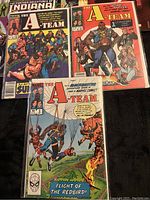 Photo showing The Further Adventures of Indiana Jones #2 and #5, A-Team issues #1, 2, 3 comic books.