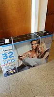 Box of Westinghouse 32 inch LCD TV showing model and features, sealed and new.