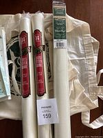 Photo of three cross stitch fabric rolls, two by Floriani brand and one Charles Craft Harmony roll, all 14 count 100% cotton fabric in white.