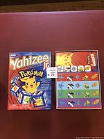 Front and back views of the Pokemon Yahtzee Jr. box showing the unopened game with character dice and score cards.