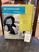 Original retail box of Sennheiser RS 110 wireless headphone system showing product branding and images.
