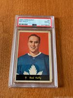 Front view of the 1960 Parkhurst Red Kelly hockey card in PSA slab showing color portrait, player name, and grading label.