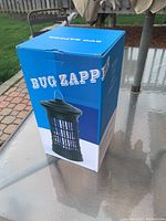 Closed box showing front label of bug zapper unit without branding.