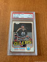 Front of the 1981 O-Pee-Chee Paul Coffey rookie hockey card in PSA graded case showing player image, team, and card grading.