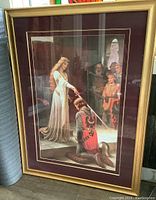 Full view of the framed print showing the knighting scene with maroon mat and gold wooden frame.