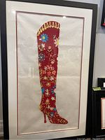 Full framed silkscreen print of red floral decorated high boot artwork, signed and numbered.
