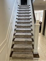 Photo of the stair runner carpet installed on stairs showing the pattern and fit.