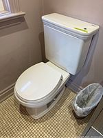 Right-side view of entire Toto toilet installed in bathroom