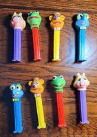 Photo of 8 opened PEZ dispensers with Muppets character heads