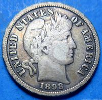 Obverse side of the 1898 Barber Dime showing Lady Liberty with laurel wreath and date at bottom.