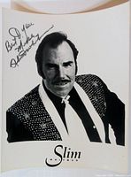 Full view of the autographed black and white photo of Slim Whitman, showing his portrait and signature.