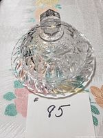 Side perspective of the vintage cut crystal domed butter dish showing the faceted knob and intricate cut patterns.