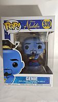 Front view of the boxed Genie Funko Pop figure showing character and box details including number 539 and Disney Aladdin branding.