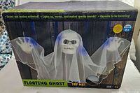 Box showing packaging for Halloween floating ghost with sound and motion, features visuals and text describing the ghost's abilities including lighting up, moving, and making spooky sounds.