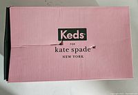 Image of pink Keds for Kate Spade shoebox with black and white text.