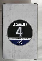 Box front showing Lecavalier name, number 4, and Tampa Bay Lightning logo with date February 10, 2018.