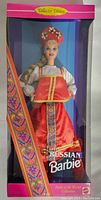 Front view of boxed Russian Barbie doll showing traditional costume and packaging.
