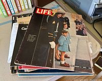 Front cover view of the December 6, 1963 vintage Life magazine showing Mrs. Kennedy and children in a funeral procession.