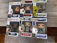 Front view of six boxed Funko Pop figures showing characters and item numbers.