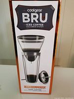 Photo of the Coolgear BRU iced coffee cold brew system box front showing brewing cone, tumbler, and lid set