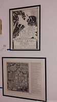 Photo showing two framed Philadelphia themed posters hung vertically, the upper poster signed and detailed.