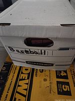 Closed white bankers box labeled 'Baseball 11' on side filled with baseball cards